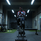 "Ted Lasso" character Sam Obisanya texting with his father while riding an exercise bike.
